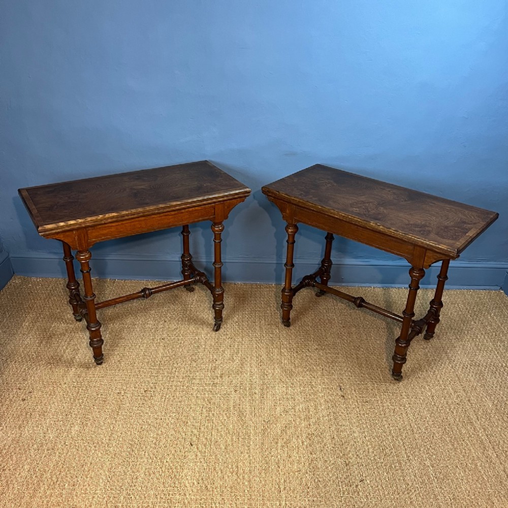 A pair of Aesthetic Movement oak and burr oak card tables circa 1875 by lamb of Manchester