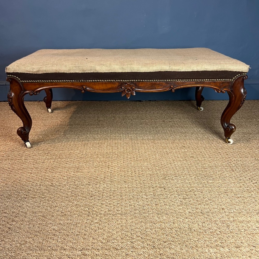 A large mid 19th century walnut centre stool circa 1850