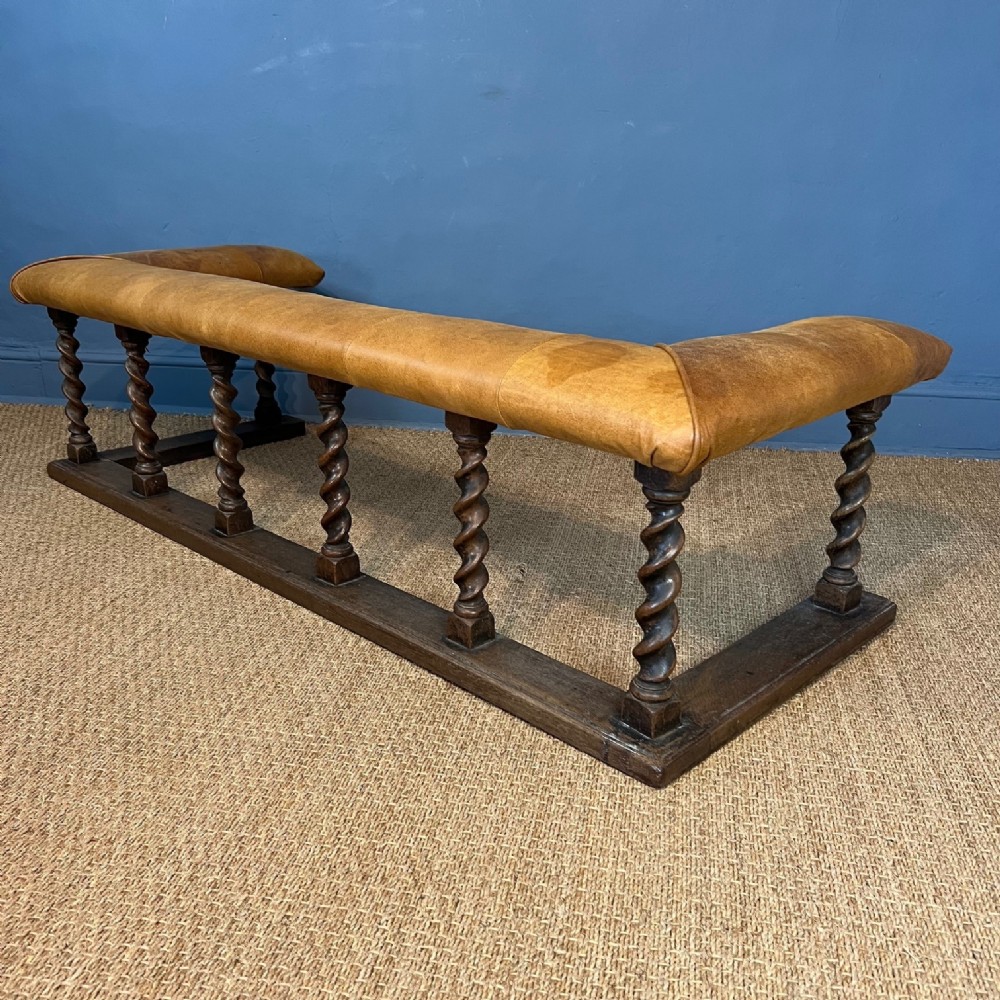 An Edwardian oak Club Fender circa 1910 