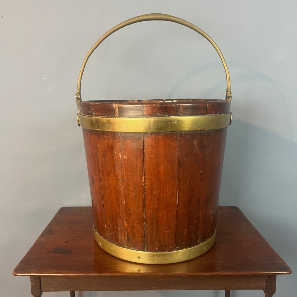 A George 111 mahogany and brass banded peat bucket circa 1800
