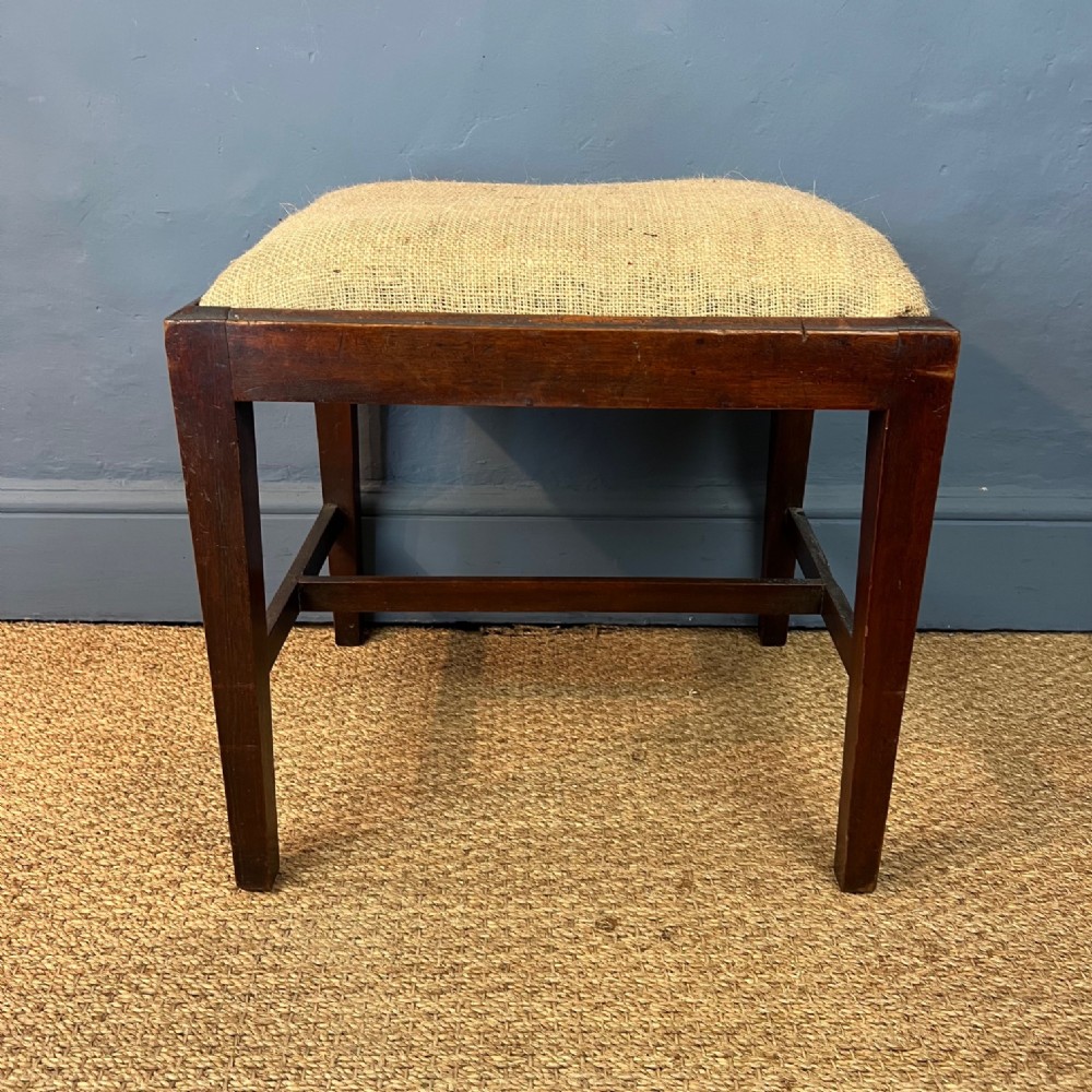 A George 111 mahogany rectangular stool circa 1800