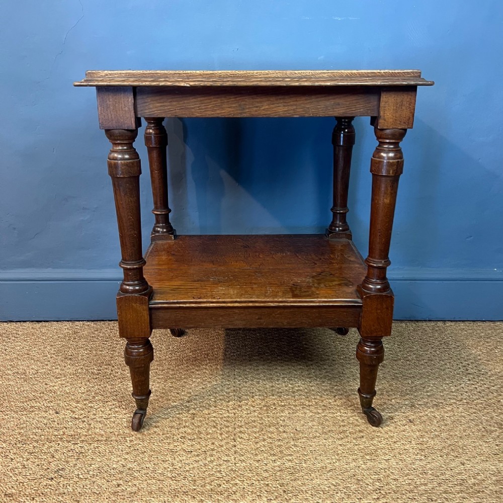 A mid 19th century oak two tier table circa 1850 