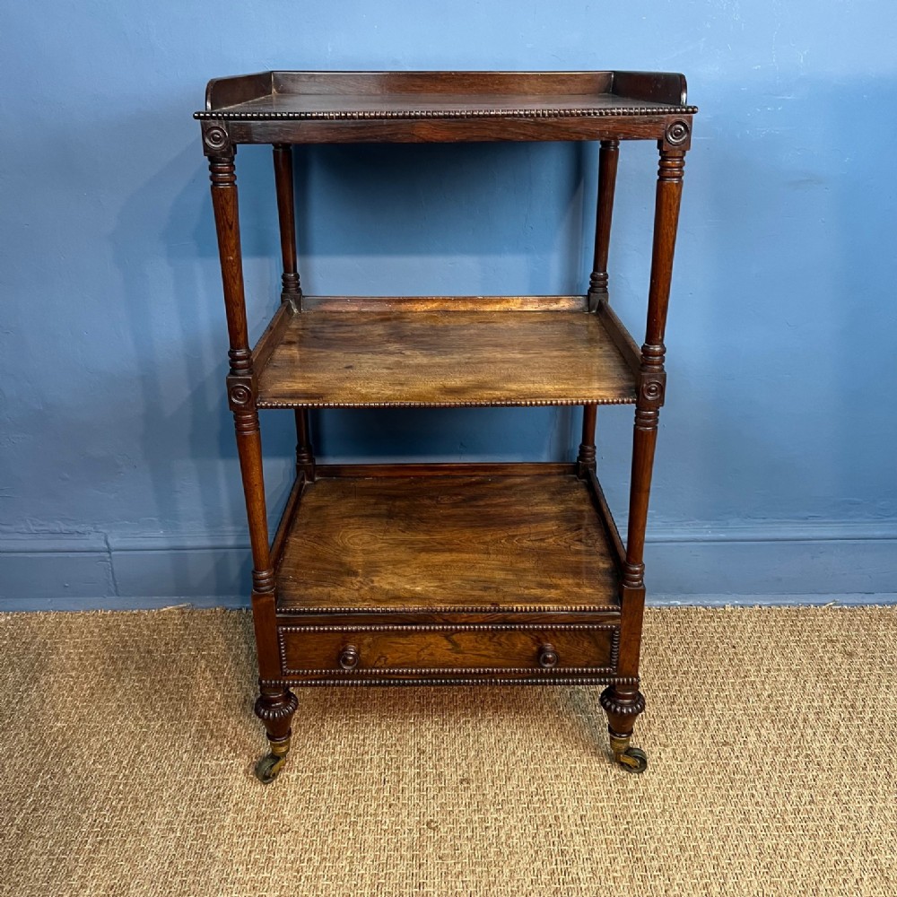 A George IV Birch and faux rosewood three tier etagere circa 1830 