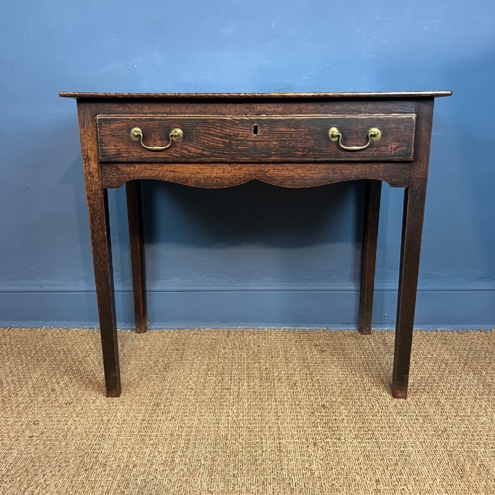 A George 111 oak side table circa 1800
