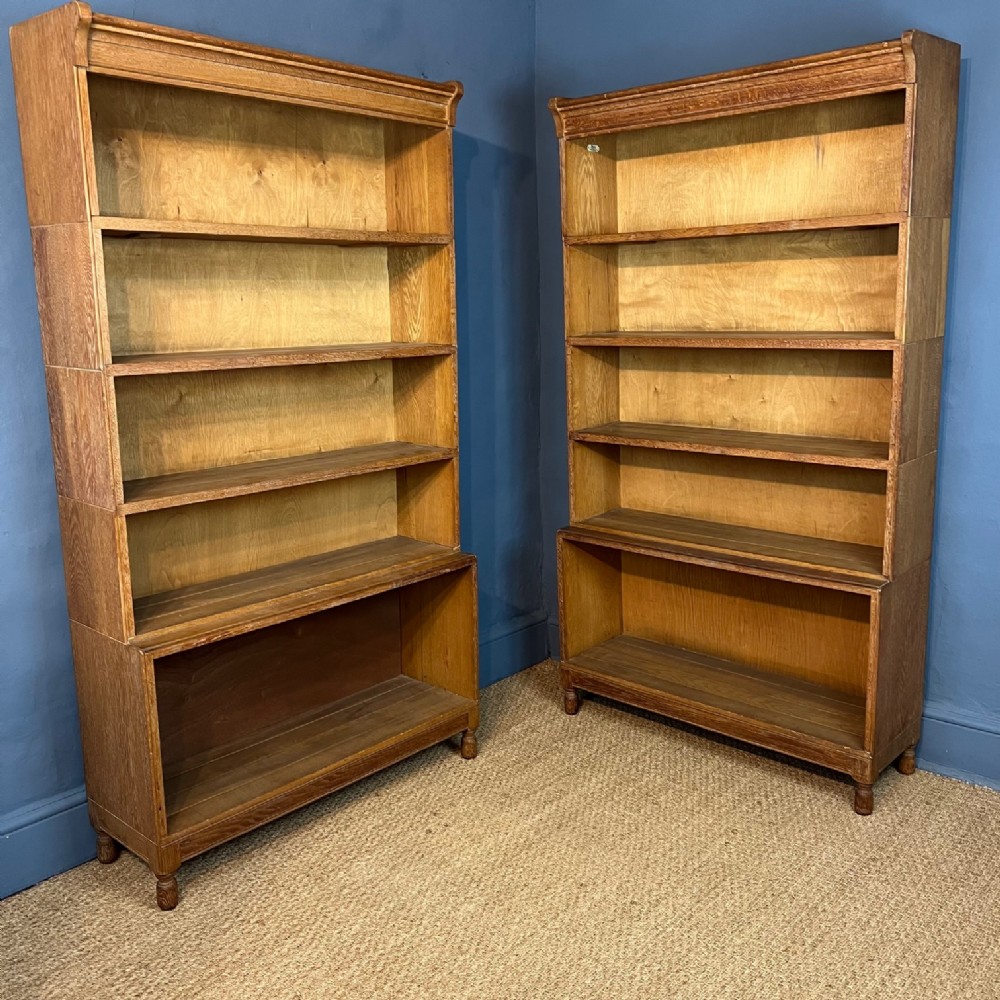  A pair of Heals oak open bookcases circa 1930 retailed by Minty`s of Oxford