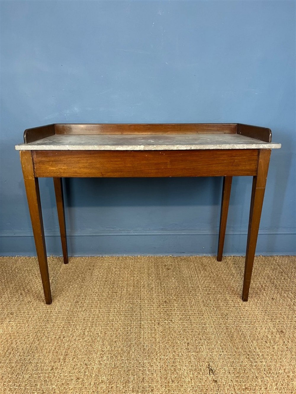 A mid 19th century country house mahogany and marble top wash stand circa 1840