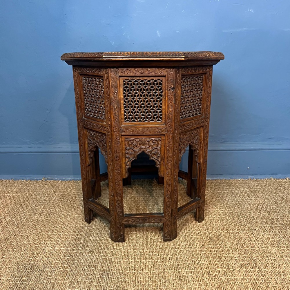 An Anglo Indian carved teak wood octagonal table. Bombay Presidency circa 1890