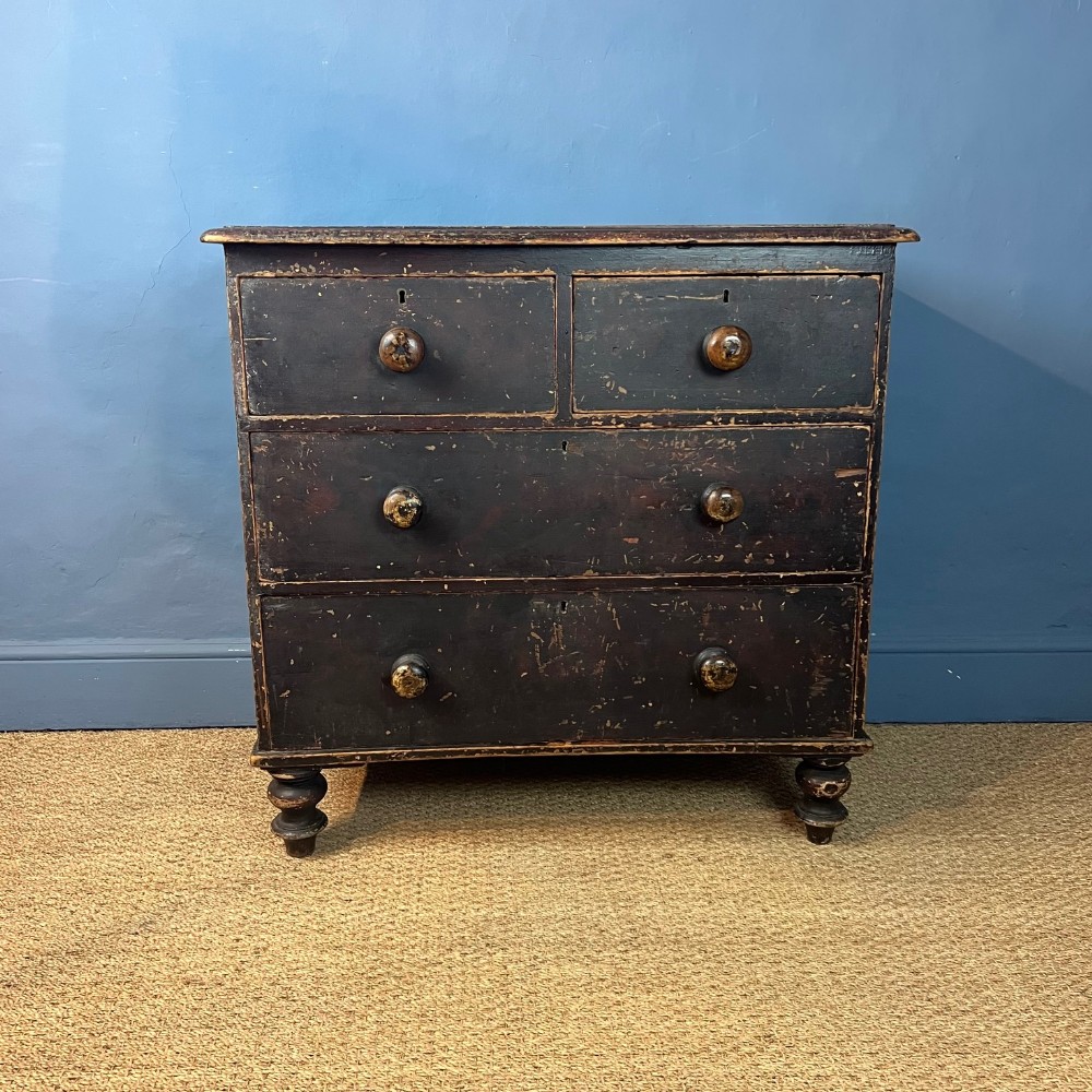 A mid 19th small painted pine chest of 2 short and two long drawers circa 1870