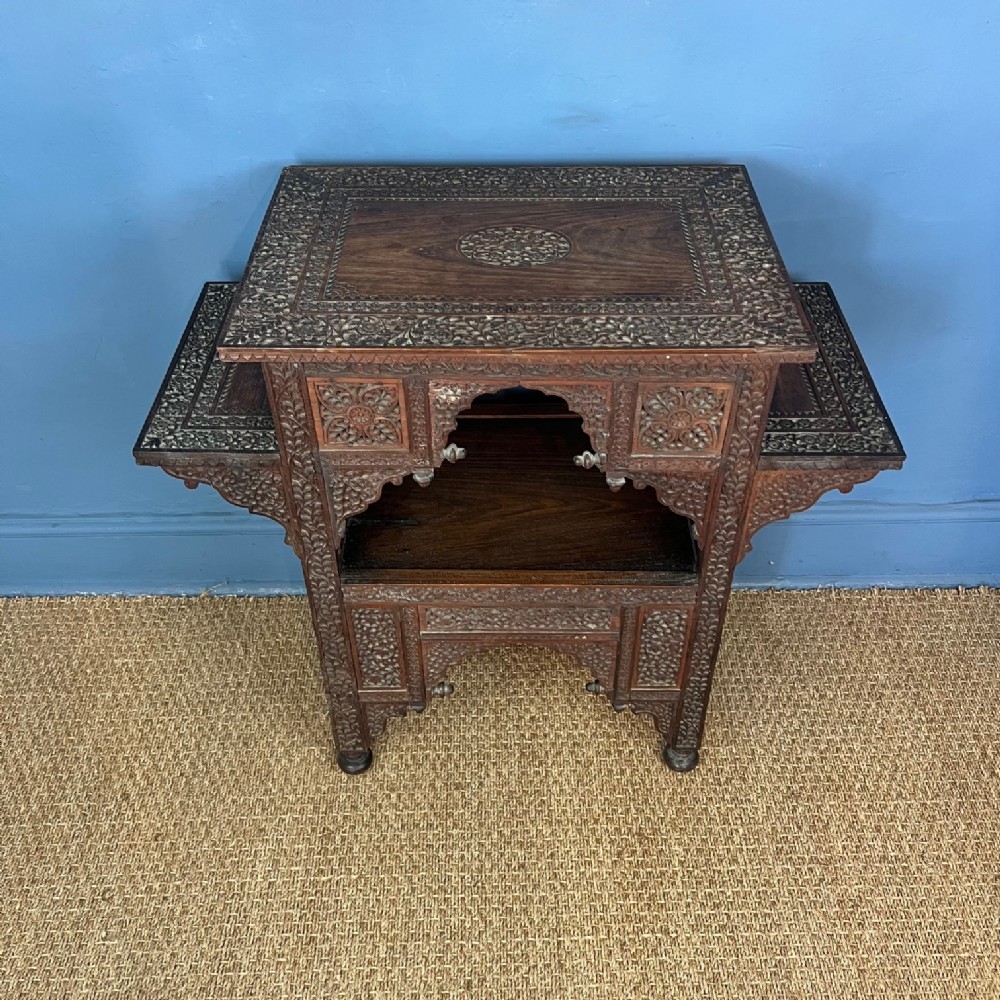 A Bombay Presidency carved wood table circa 1890