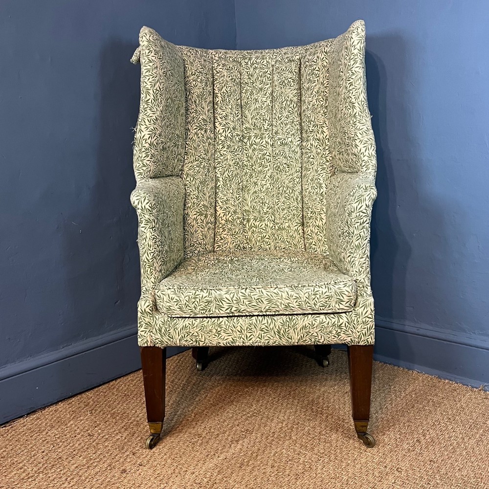 A George 111 mahogany barrel back wing chair circa 1810 