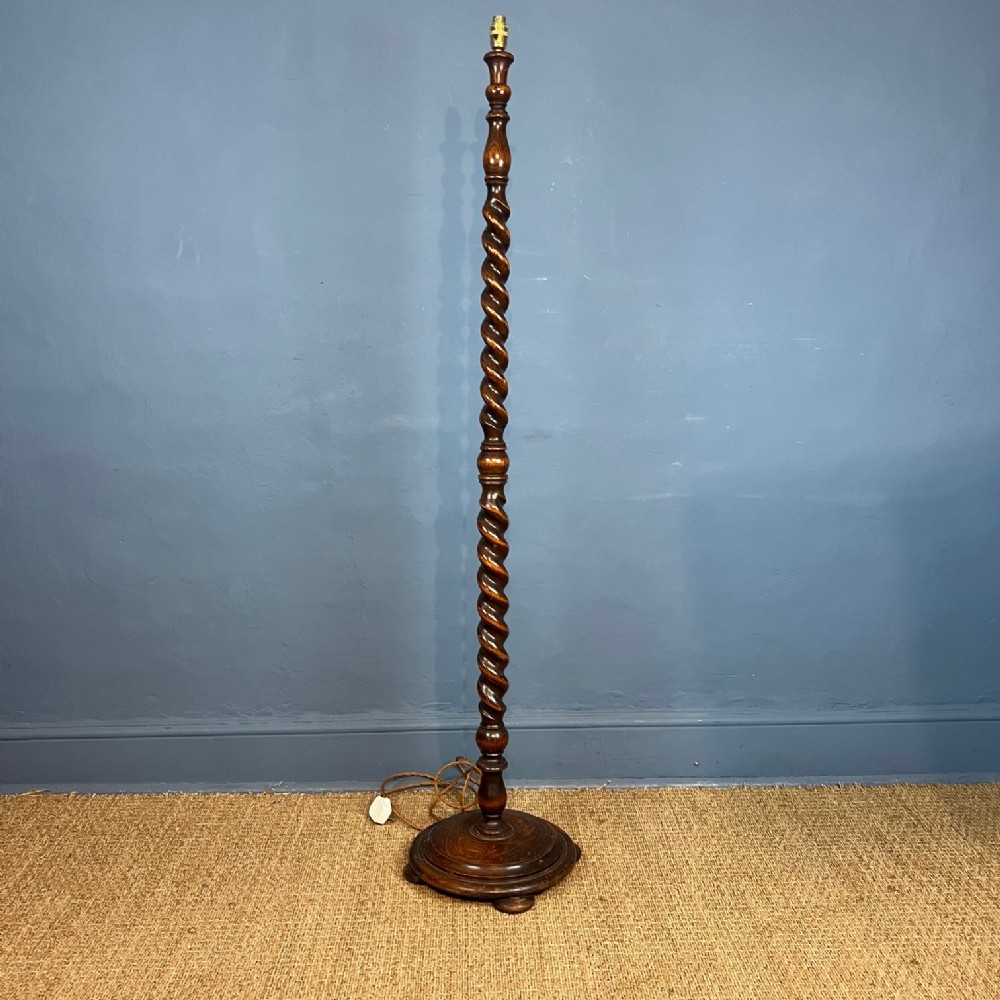 An Edwardian oak barley twist standard lamp circa 1910