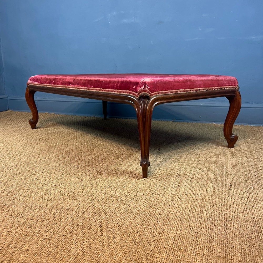 A large mid 19th walnut cabriole leg stool