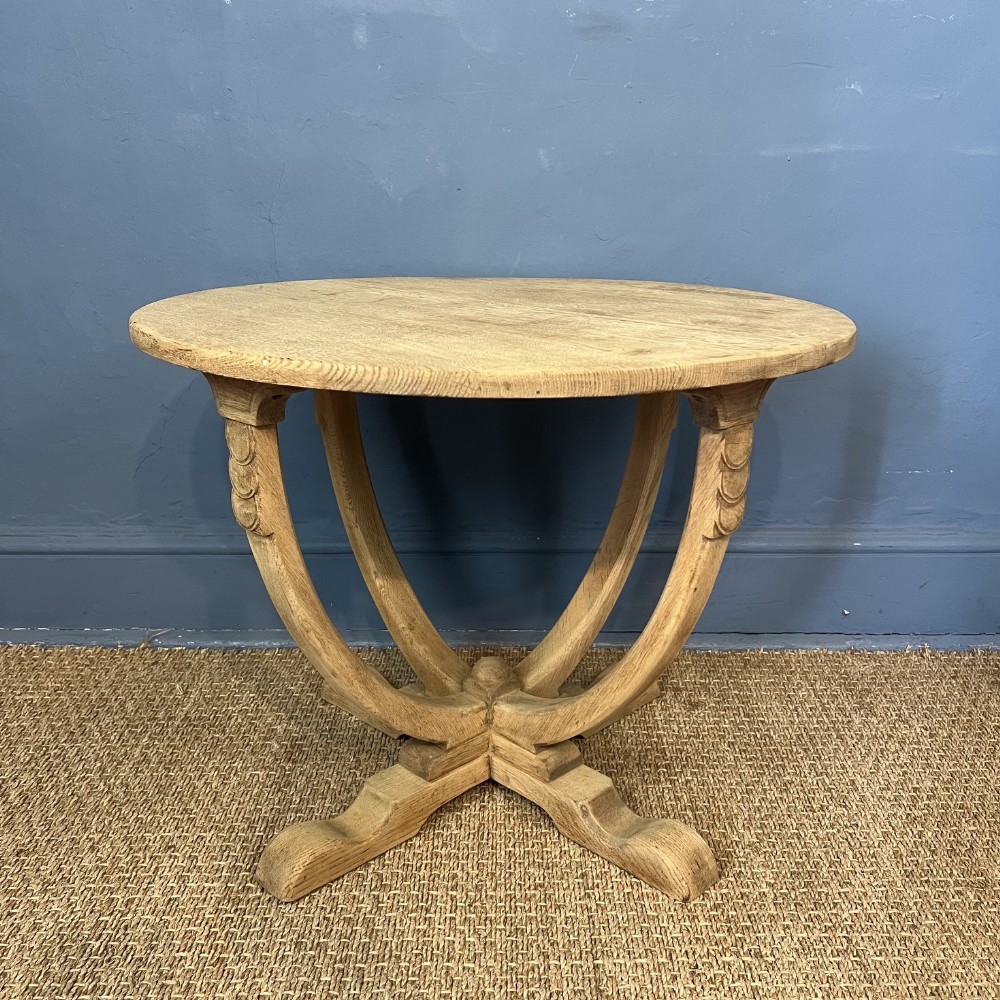 An Arts and Crafts oak circular table circa 1930.