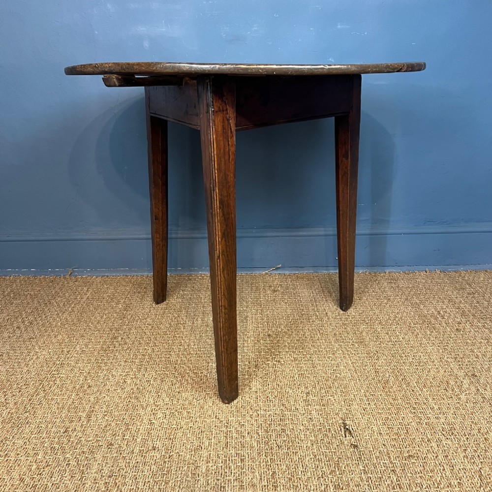 A George 111 oak West Cricket table circa 1800