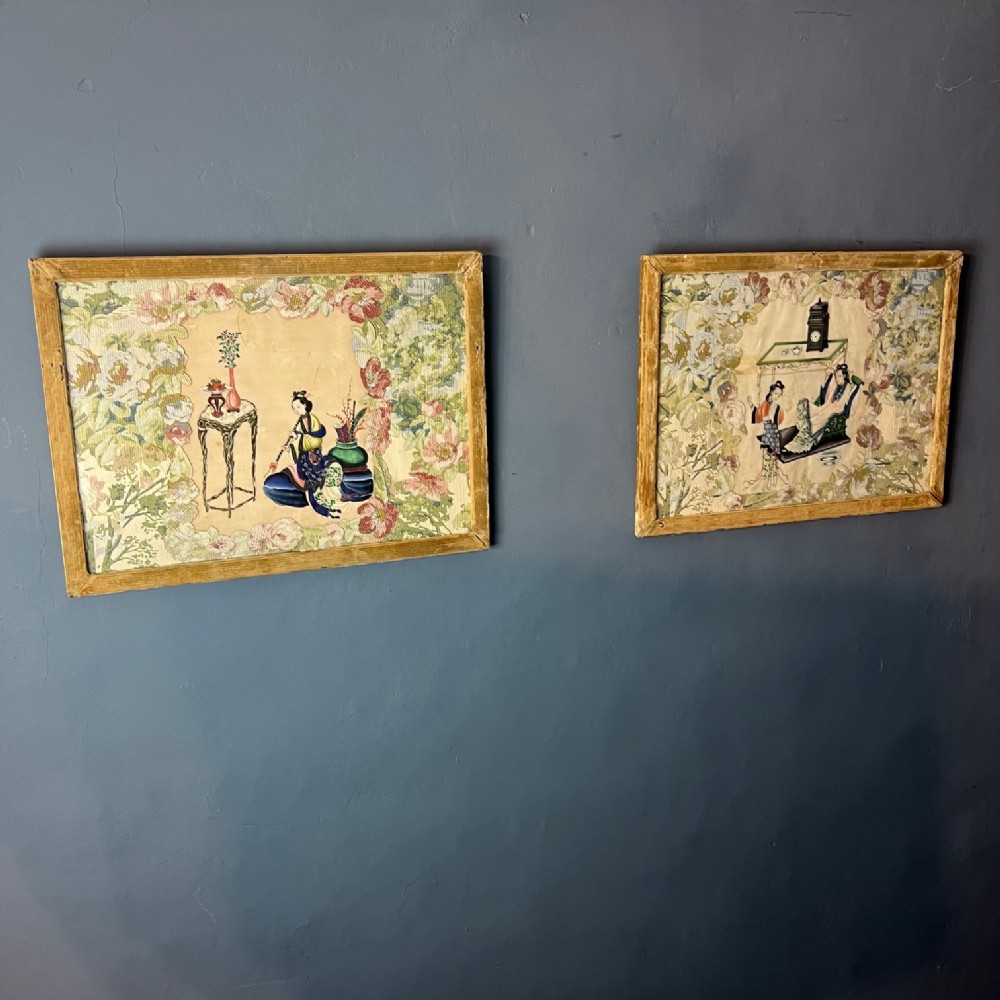 A pair of framed late nineteenth-century Chinese watercolour paintings on embossed card featuring figures surrounded by floral borders.