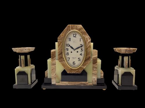 A French Art Deco Clock with Its Pair of Matching Garnitures