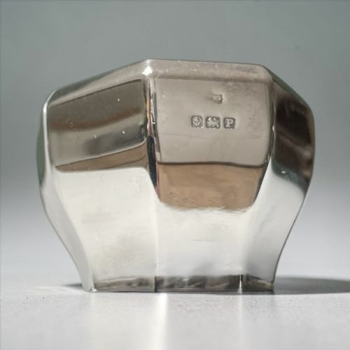 fig 1. A complete Art Deco sterling silver condiment set including faceted pepper casters, salt cellars with cobalt blue glass liners, mustard pots, and spoons alongside a fitted blue presentation box.