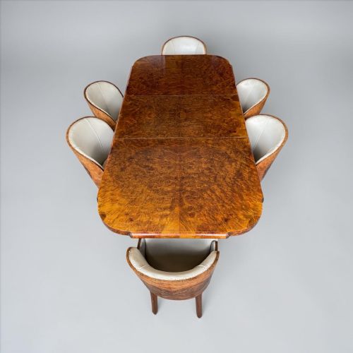A Superb Dining Table and Six Chairs by Maurice Adams