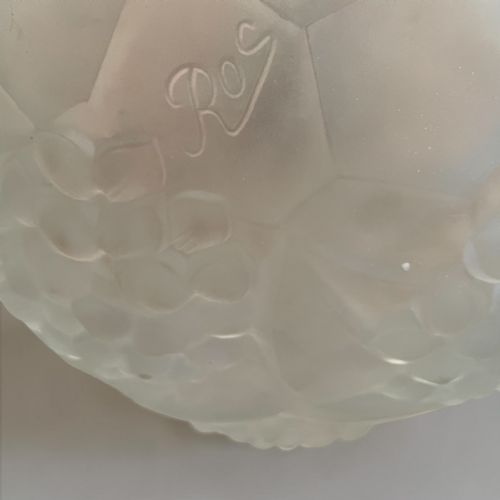 fig 3. An Art Deco ceiling light featuring a central moulded frosted glass bowl and matching outer shades supported by an ornate bronze mount.