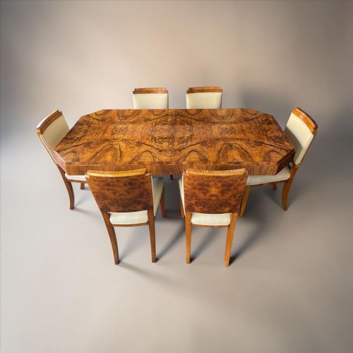 A Fine Art Deco Burr Walnut Dining Table and Six Chairs