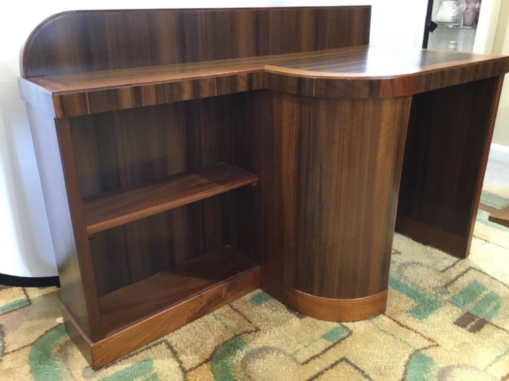 An Art Deco Walnut Desk and Bookcase