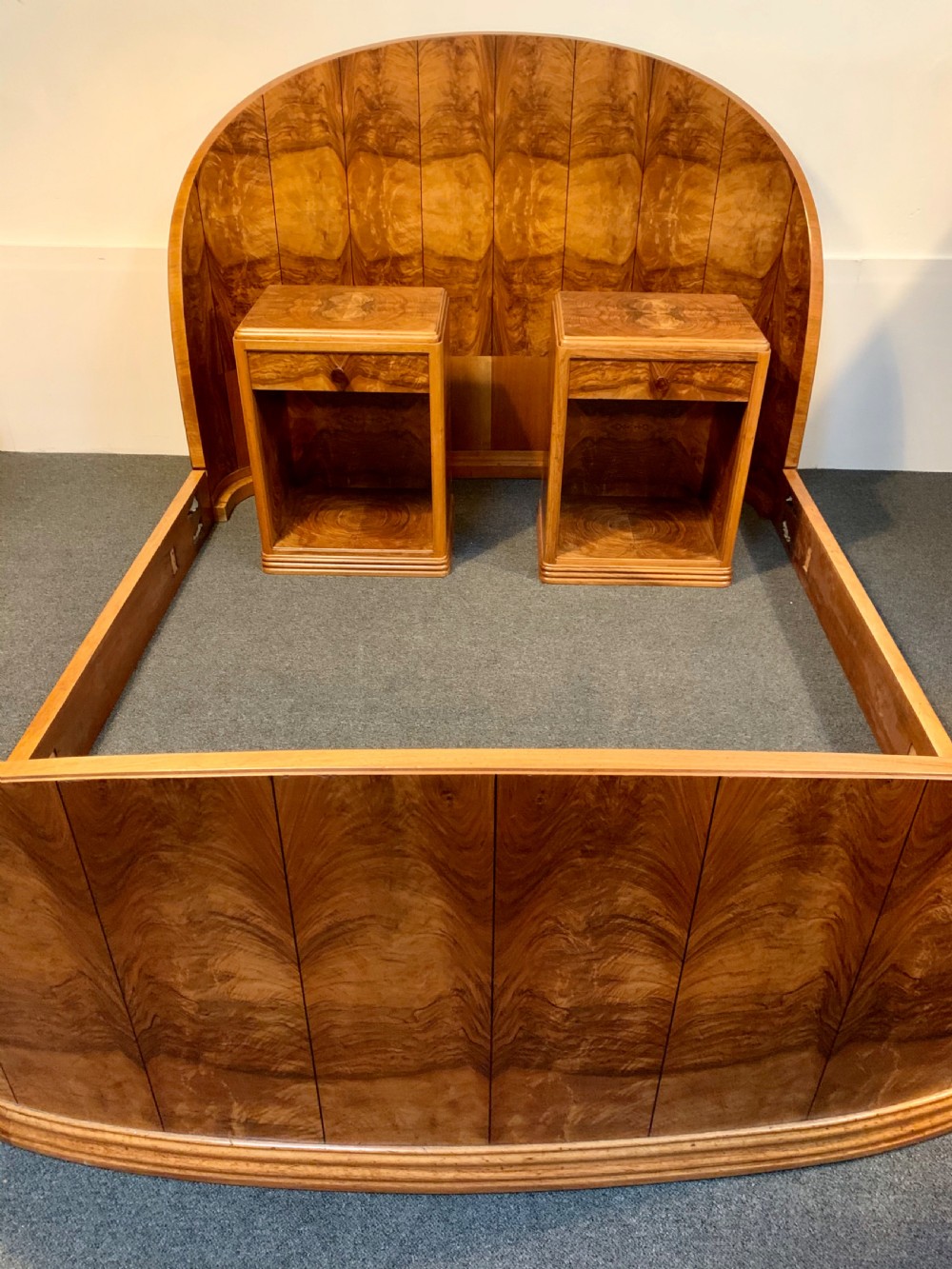A French Art Deco Bed and A Pair of Matching Bedside Cabinets