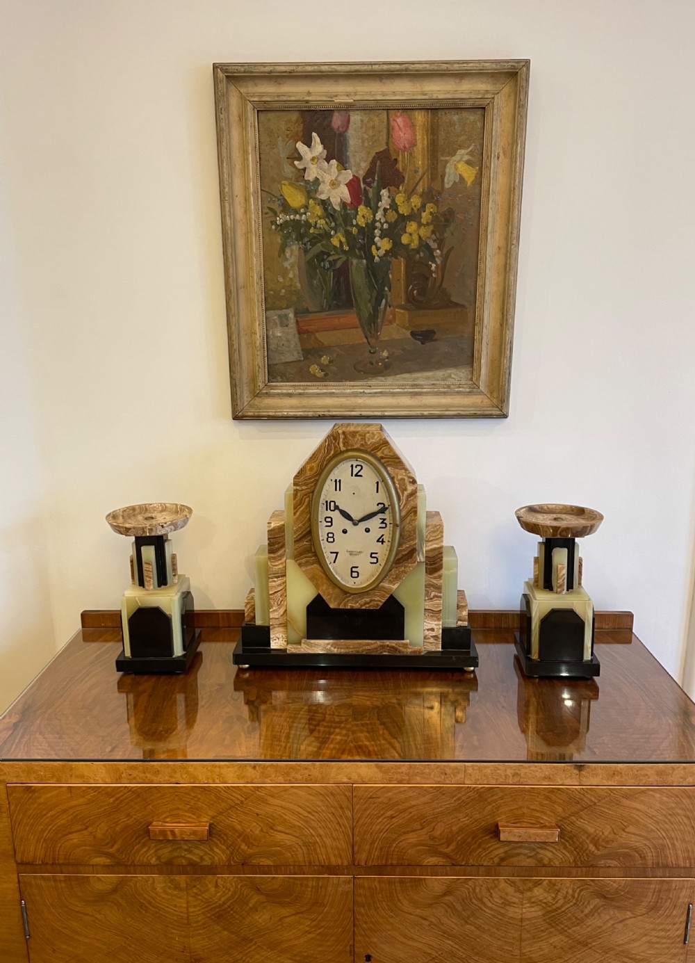 A French Art Deco Clock with its pair of matching garnitures View IX