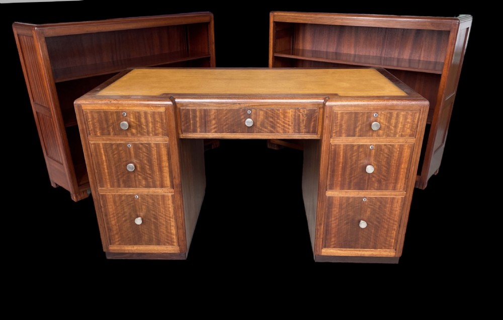 A matching pair of low, open-front Art Deco wooden bookcases with three shelves and fluted side panels. View XII