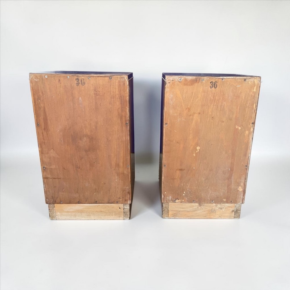 A matching pair of Art Deco walnut bedside cabinets featuring book-matched wood grain, single top drawers, rounded sides, and lower cupboard doors. View VIII