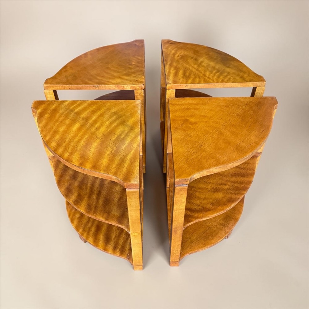 An Art Deco golden timber nest of five tables consisting of a central circular table encircled by four matching tiered wedge tables. View IV