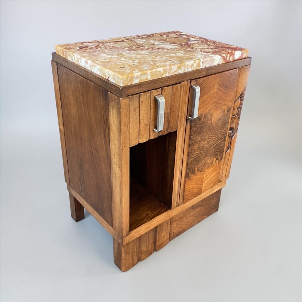 An Art Deco bedside cabinet crafted from polished brown walnut wood featuring a variegated reddish marble top surface and metal handles. View II