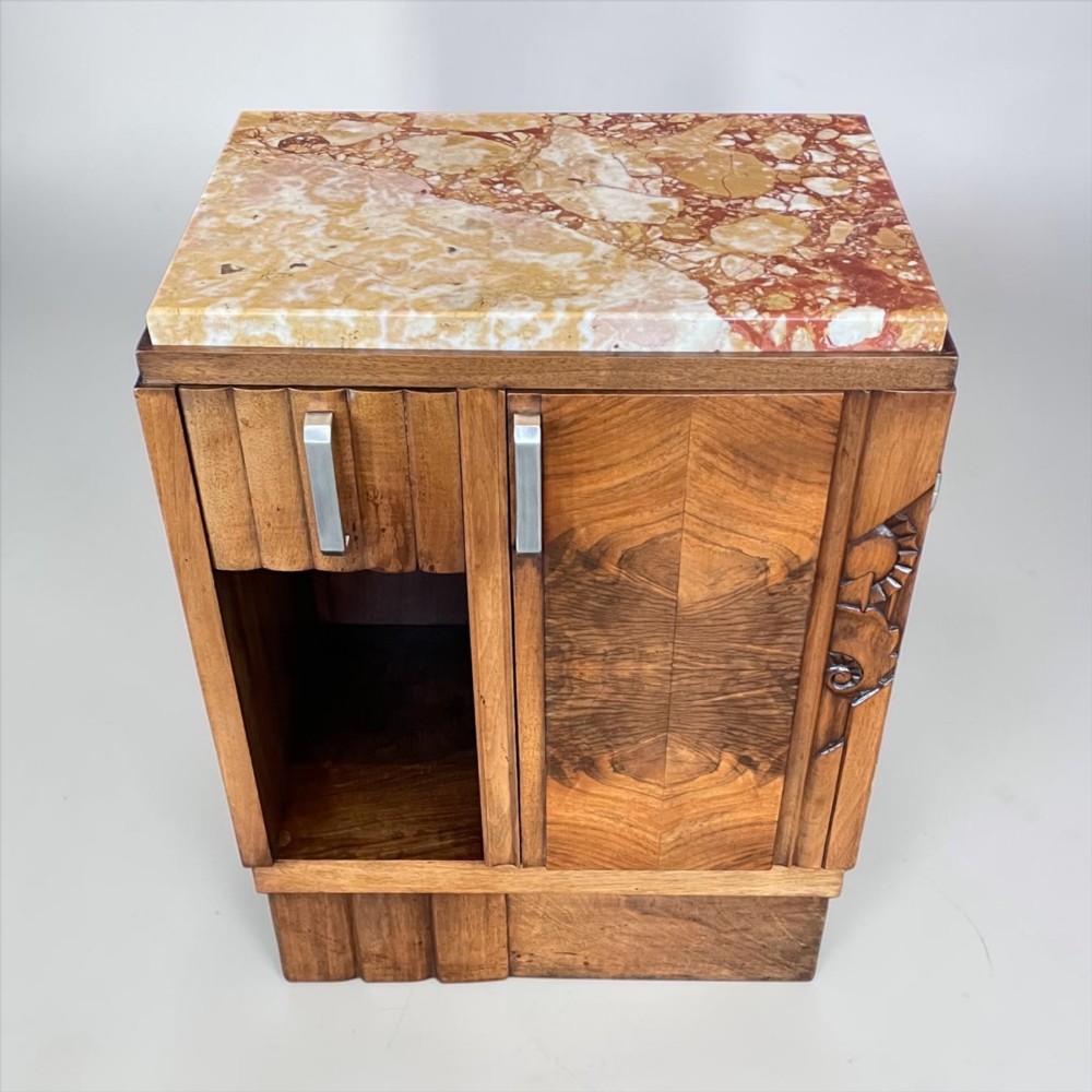 An Art Deco bedside cabinet crafted from polished brown walnut wood featuring a variegated reddish marble top surface and metal handles. View III