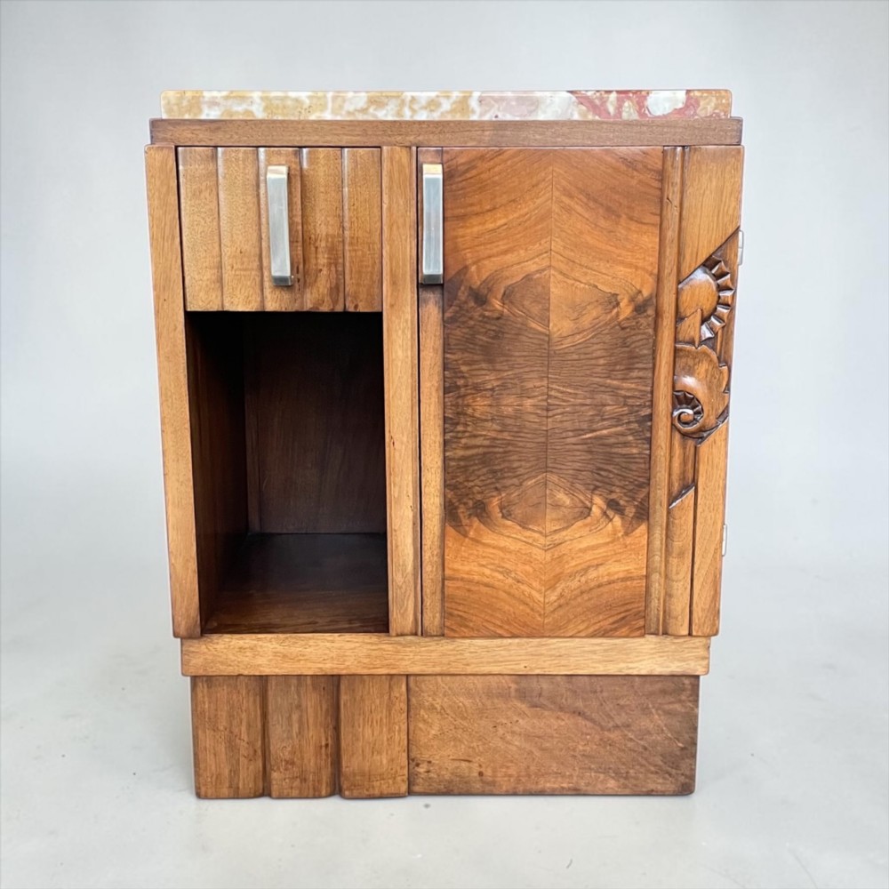 An Art Deco bedside cabinet crafted from polished brown walnut wood featuring a variegated reddish marble top surface and metal handles. View IV