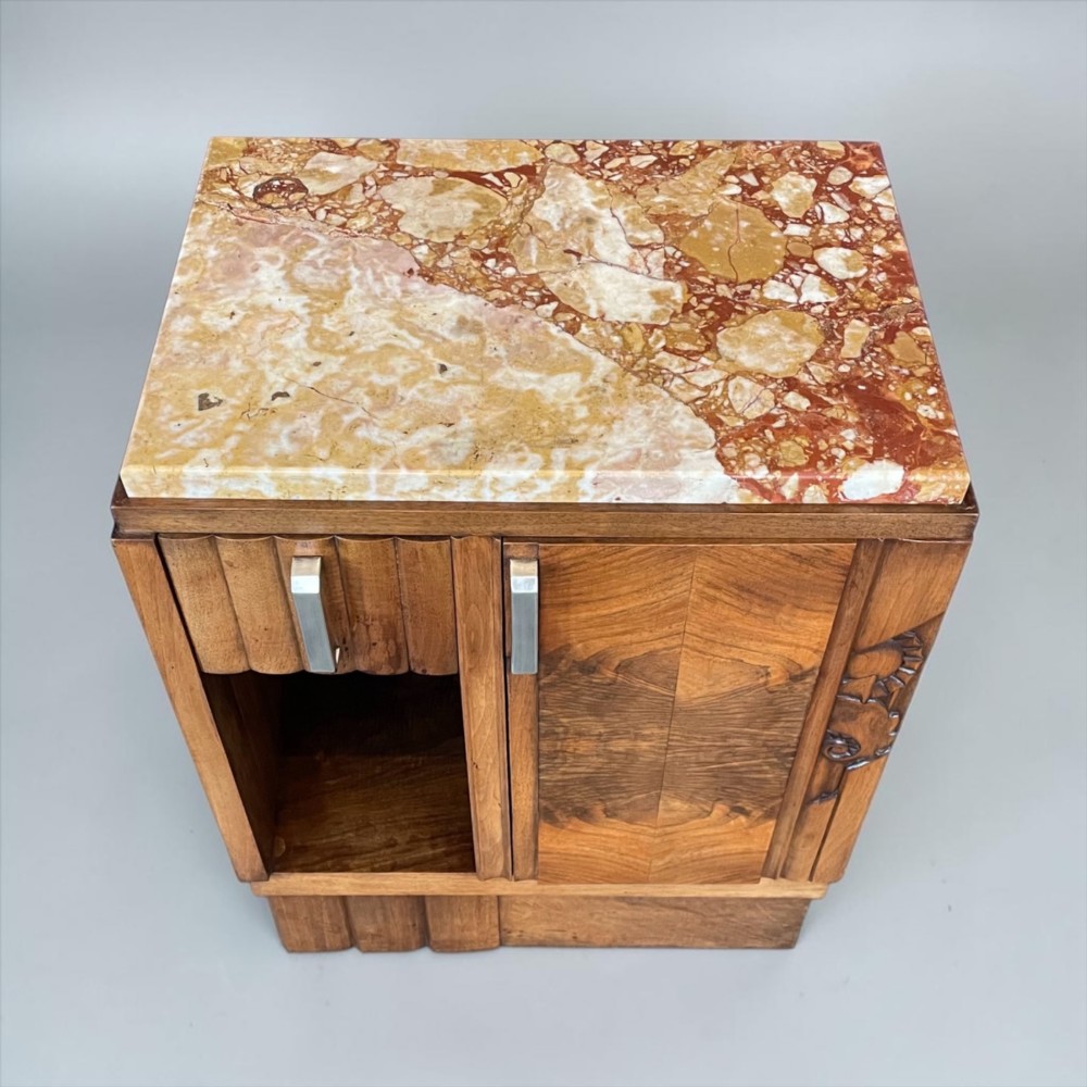 An Art Deco bedside cabinet crafted from polished brown walnut wood featuring a variegated reddish marble top surface and metal handles. View VIII