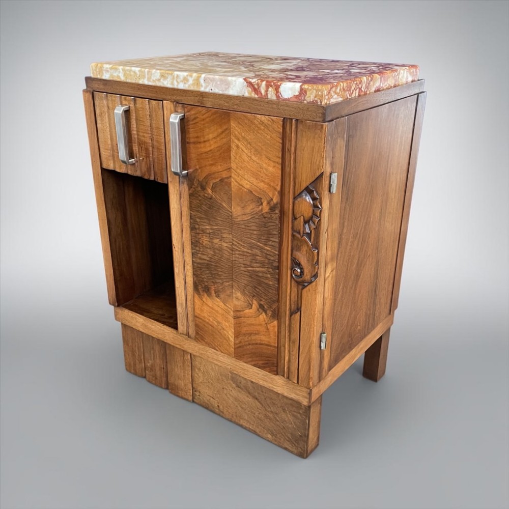 An Art Deco bedside cabinet crafted from polished brown walnut wood featuring a variegated reddish marble top surface and metal handles. View XI