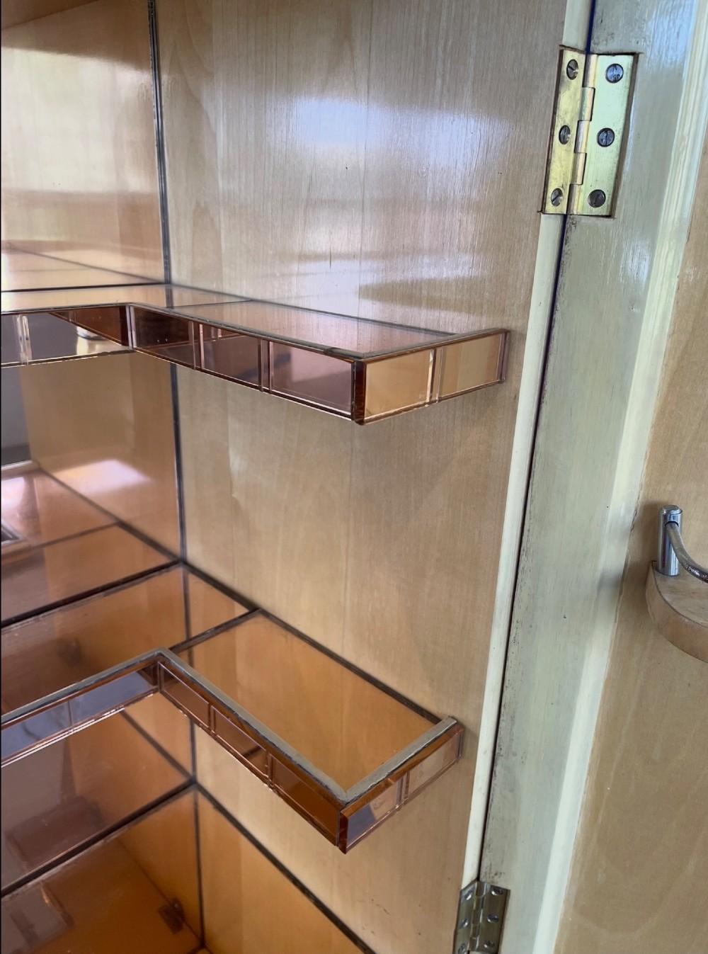 An Art Deco burr walnut cocktail cabinet with open upper doors revealing a mirrored interior, flanked by lower etched glass display sections. View VIII