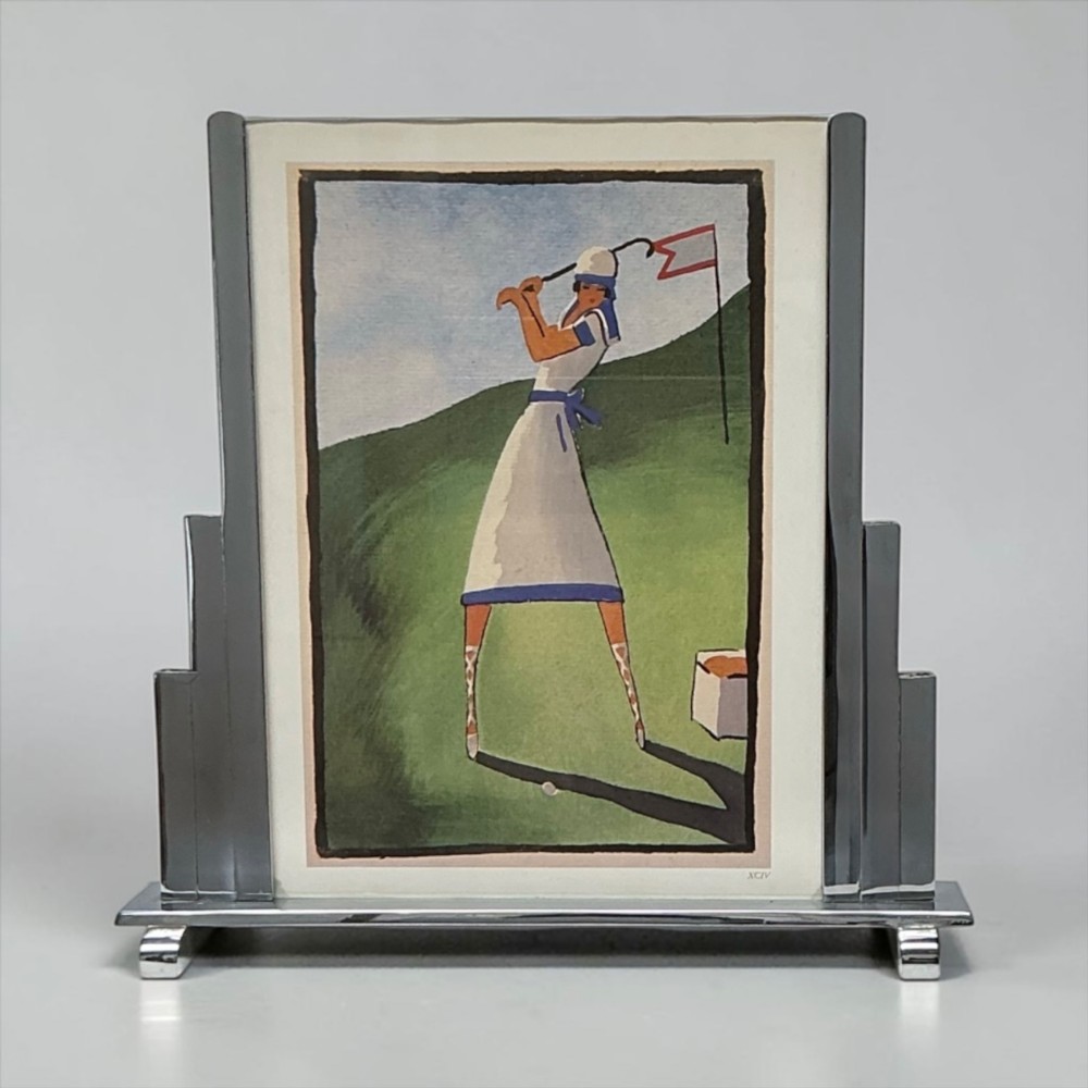 An Art Deco chrome picture frame featuring stepped geometric side supports on a rectangular metal base. View II