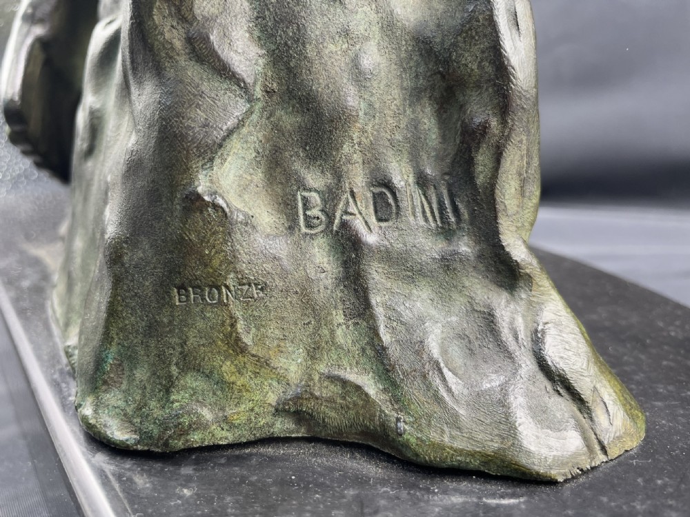 An Art Deco patinated bronze sculpture depicting two eagles with outstretched wings mounted on a rocky outcrop and dark marble plinth. View V