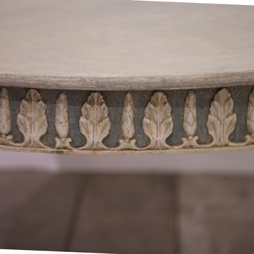 A pair of semi-circular Swedish Gustavian style console tables featuring grey and off-white painted finishes with carved leaf patterns around the apron and tapered legs. View IV