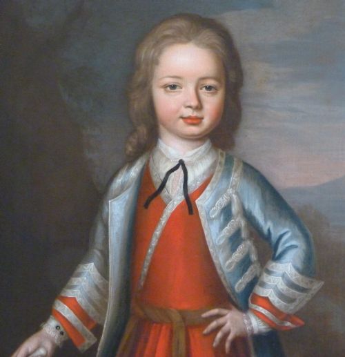 fig 1. An 18th-century oil portrait depicting a young boy in a red tunic and blue trimmed jacket, housed in an ornate carved gilded frame.