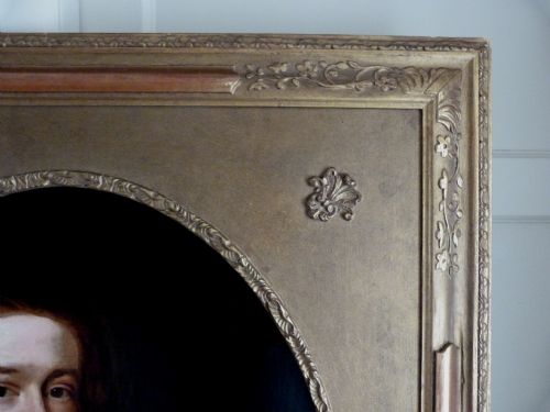 fig 4. An 18th-century oil painting depicting a young man in Georgian attire set within an oval aperture inside a gilded rectangular frame.