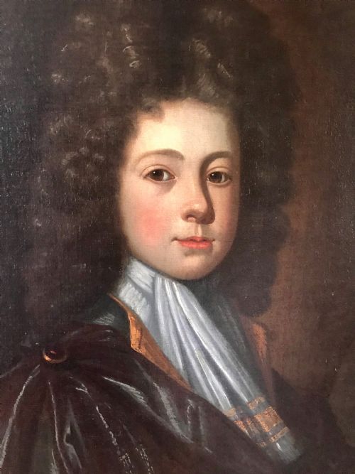 fig 2. An early 18th-century oil portrait depicting a young male with long dark curled hair, a light blue cravat, and a dark draped cloak against a dark background.