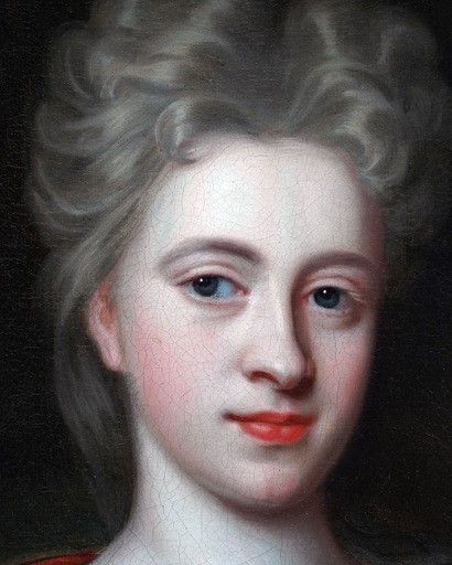 fig 2. An oil portrait painting depicting a lady in green drapery and a red shawl set within an oval spandrel and a carved giltwood frame.
