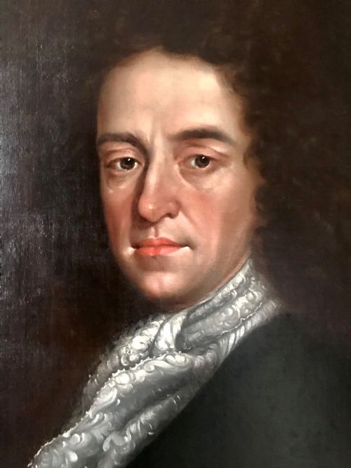 fig 2. A late 17th-century Scottish oil portrait depicting a gentleman with a dark full-bottomed wig and lace cravat set within a painted feigned oval and carved gilded wooden frame.