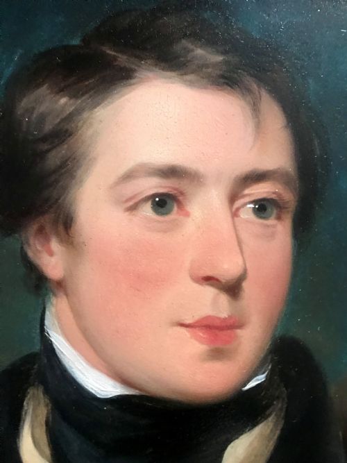 fig 3. An early 19th-century portrait painting of a gentleman wearing a dark coat and white cravat, encased in an ornate giltwood frame with a brass nameplate.