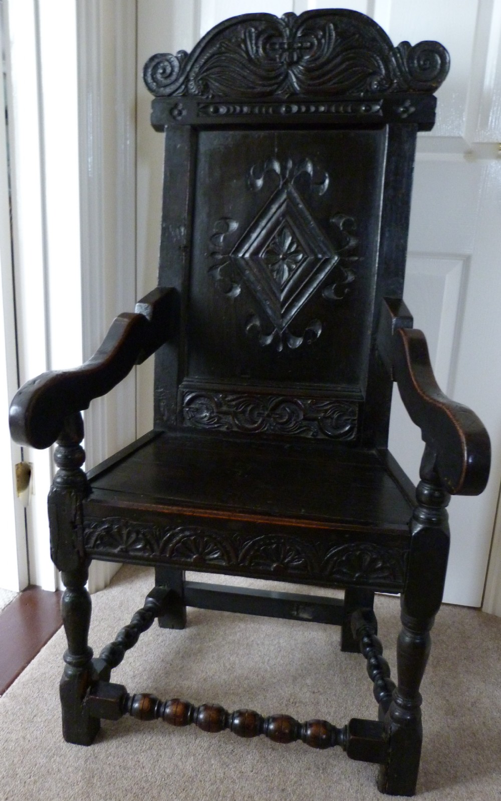 Oak wainscot chair c.1660 and later.