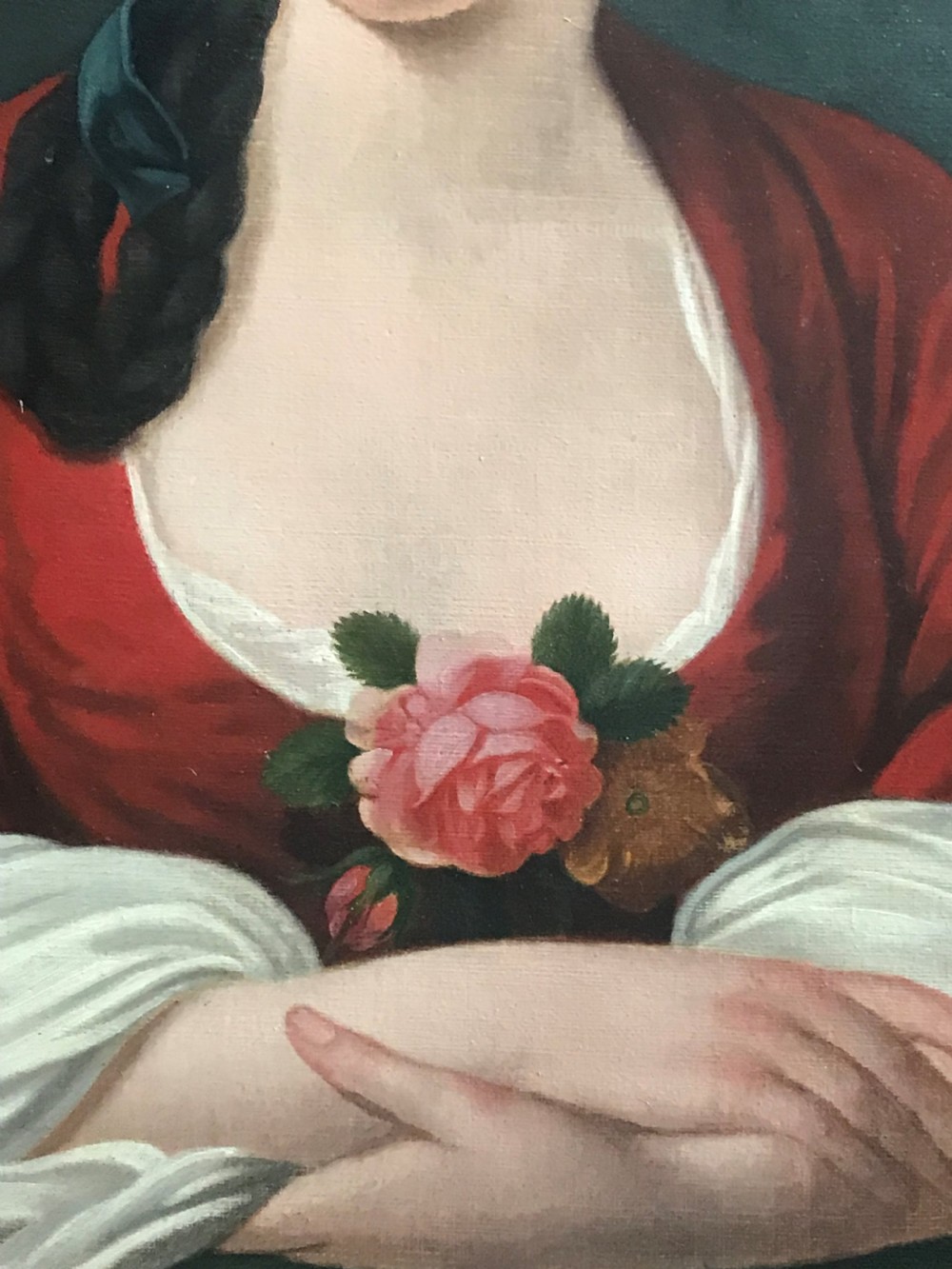 An 18th-century oil portrait painting of a lady wearing a red dress with a pink floral corsage, displayed within a moulded giltwood frame. View III