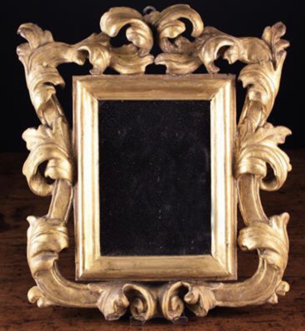 Small 17th century carved giltwood mirror.