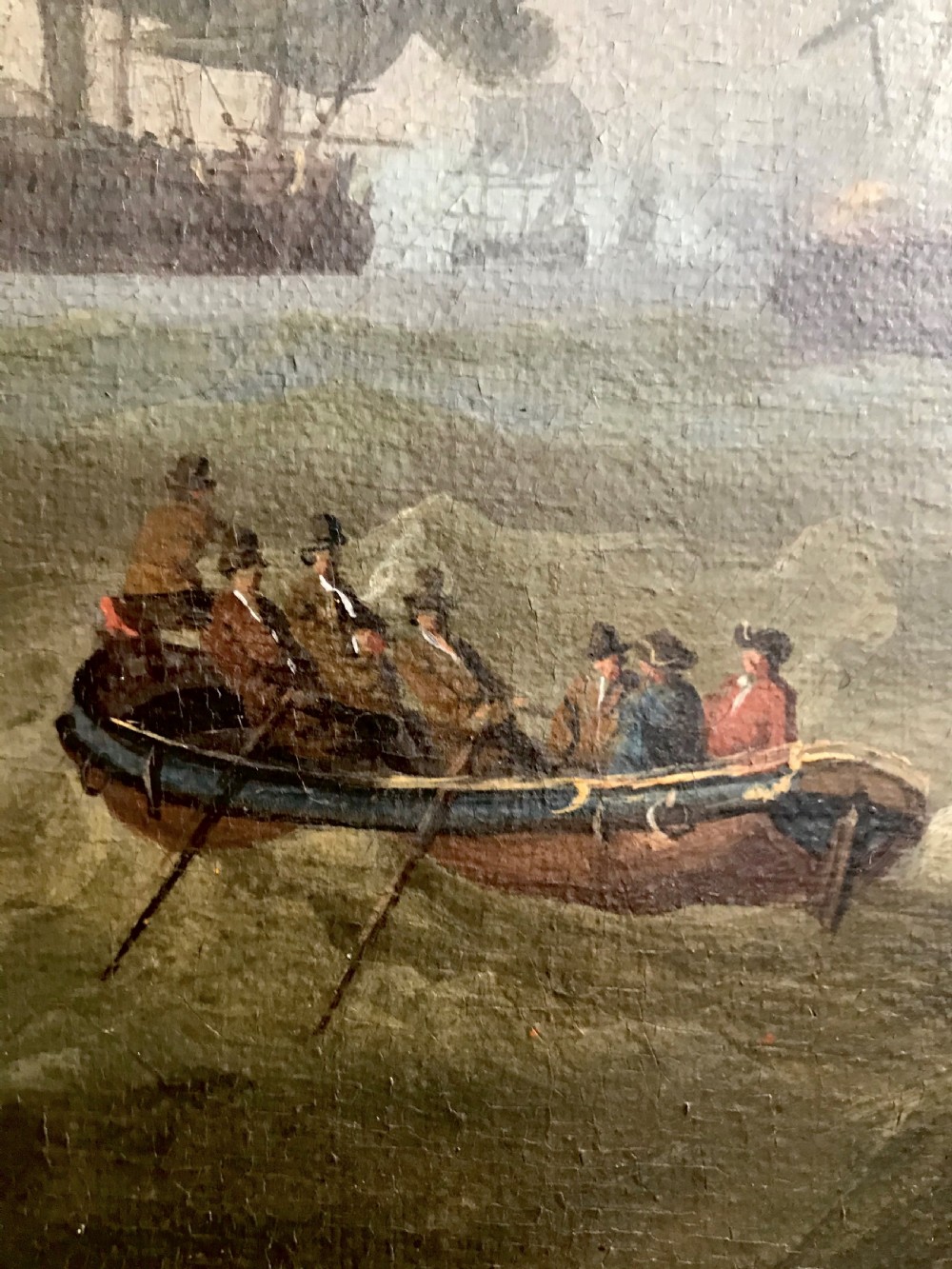 An antique seventeenth-century oil painting depicting Dutch warships engaged in a sea battle, housed within a wide marbled frame. View IV