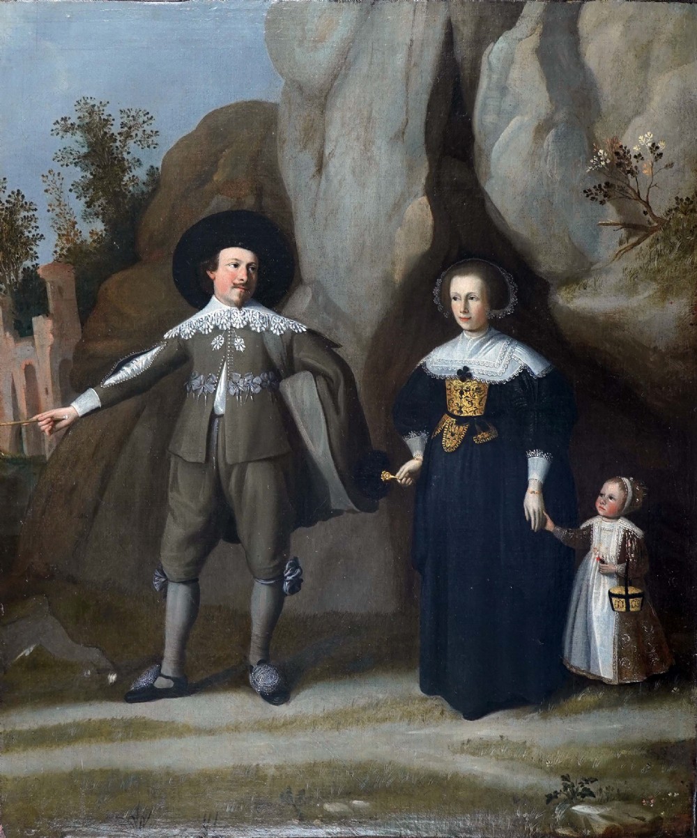 A seventeenth-century oil painting depicting a Dutch man, woman, and child standing outdoors in period costume against a rocky backdrop.